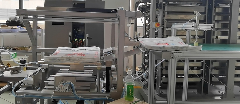 Automatic PP woven block bottom valve bag insertion machine manufacturing plant cost Automatic PP woven block bottom valve bag insertion machine manufacturing plant cost